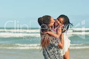 Building strong bonds at the beach. a mother and her little daughter enjoying some quality time together at the beach.