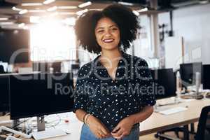 Im always happy to be at work. Portrait of an attractive young female designer smiling and in good spirits at the office.