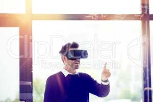 Transporting his ideas through a whole new dimension. Multiple exposure shot of businessman wearing a VR headset superimposed over city traffic.