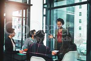 Our aim would be to get this project globally recognised. a businesswoman giving a presentation to her colleagues in an office.