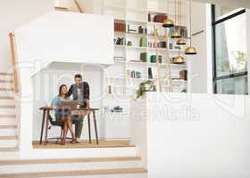 Excuse me, Im trying to work here. a happy young man checking in on his wife while she works from her desk at home.