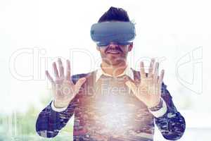 Glancing into the future. Multiple exposure shot of businessman wearing a VR headset superimposed over a cityscape.