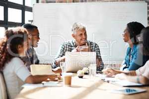 Im glad to be able to share this with you. a group of colleagues having a meeting in the boardroom.