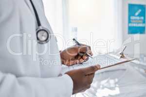 Medical, insurance and doctor filling out patient history for diagnosis at the hospital. Healthcare professional working on clipboard with paper, consulting and writing health paperwork at a clinic.