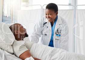 Healthcare doctor, insurance, and patient in bed talking of medical health surgery in hospital or clinic. Trust, care and help checkup by a happy, woman cardiologist worker consulting a sick person