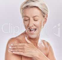 Beauty, bodycare and woman applying lotion for skincare routine applying lotion on her body. Studio portrait of a happy and excited senior female with glowing and smooth skin using anti aging cream