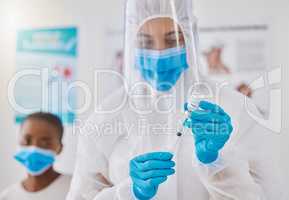Vaccine, injection and medicine cure for covid, monkeypox and ebola with doctor, healthcare or medical professional. Frontline worker in hazmat suit getting ready to inject clinic or hospital patient