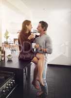 You are just what my heart needs. an affectionate young couple having a coffee break at home.