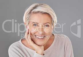 Skincare, beauty and happy senior woman or face model with healthy teeth giving a smile on a headshot studio portrait. Dental, wellness and cosmetic surgery for elderly women to stay beautiful