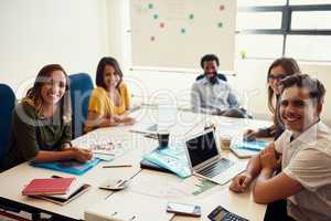 We aim to keep our creativity consistent. creative employees having a meeting in a modern office.