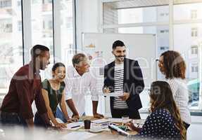 First creativity, then determination, then persistence, then success. a group of creative employees working in a modern office.