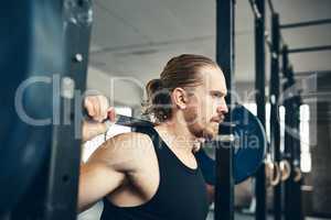 Dont wait, dont hesitate, lift weights, be great. a man lifting weights at the gym.