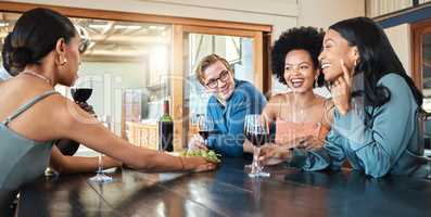 Social friends drinking wine, relaxing and talking together in a restaurant for fun, reunion and happy bonding. Diversity of smile people enjoying conversation, food and drink at a dining party