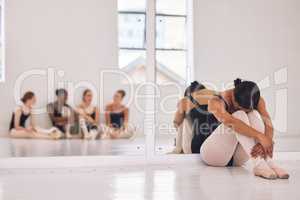 Bullying, stress or sad ballerina in training with ballet dancers, artists or professional studio performers. Upset, unhappy or anxious girl with bad mental health from bullying in theater rehearsal