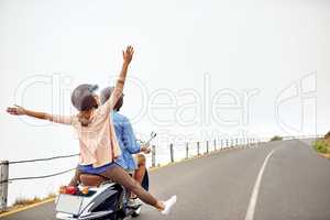 Make sure youre as free as you can be. an adventurous couple out for a ride on a motorbike.