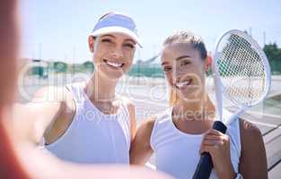 Tennis, selfie and friends smiling and feeling happy while standing together on a sports court. Portrait of athletic women playing in professional competition. Enjoying active hobby during free time