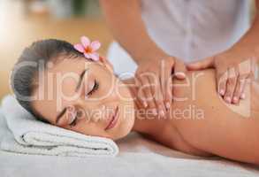 Theres hardly any experience more blissful. an attractive young woman enjoying a back massage at a spa.