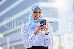 Islam, islamic or business woman on her phone in hijab texting in the city with mockup. Diversity, muslim and arabic international employee on mobile working in town or global corporate company.