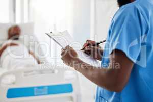 Healthcare, insurance and hospital plan by medical intern writing and filling out form. Health care professional doing admin, keep record of sick patient medication and treatment in a hospital