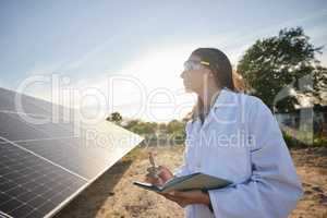 Woman working in solar energy, writing research on solar panels and studying sustainability of clean energy in summer. Scientist expert doing analysis on future innovation and green electricity