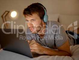 Online, laptop and late night stream or work in the bedroom. Man using internet on pc to watch series, esports or gaming to relax. Stress management and entertainment with online technology at home.