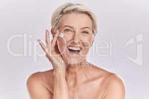 Skin, skincare or collagen lotion with old woman posing with a smile with her cosmetics and product. Senior female, facial cream and sunscreen for a healthy face and beauty model wellness portrait.