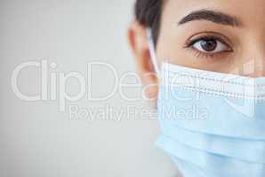 Health, wellness and covid safety mask of a young woman face and head. Eye zoom of a female with nose and mouth cover for prevention and protection from corona virus, flu and cold in a pandemic