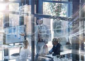 First learn then remove L. Multiple exposure shot of a businessman explaining information to coworkers in the office superimposed on a cityscape.