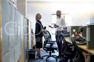 I have some ideas that Id like to present to you. two businesspeople having a discussion in an office.