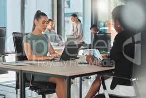 Office corporate business female employees, coworkers and team working online with digital electronics. Diverse advertising and social media marketing company or agency staff busy with client work