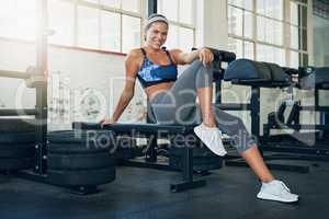 Work out because you love your body. a young attractive woman working out in a gym.