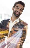 Id say that success definitely suits me. Cropped portrait of a handsome young businessman superimposed on a cityscape.