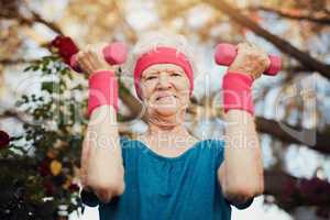 Maintain your health, train your body. a senior woman exercising at home.