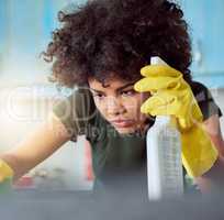 Im not afraid of germs. an attractive young woman with yellow gloves cleaning her home.