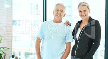 Physiotherapy made life easier for him. a physiotherapist and her senior patient standing together.