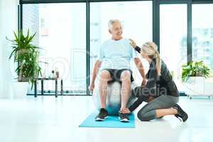 I want to help heal your suffering. a senior man working out in a rehabilitation center.