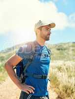 Hes an adventure seeker. a young man out on a hike.