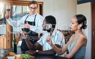 Wine tasting with black couple and professional sommelier explaining the blend and flavor of red wine. Couple enjoying a drink, learning about wine making process at a restaurant with happy winemaker