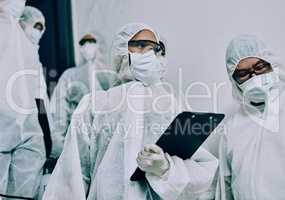 Doctors, healthcare workers and health team doing inspection, cleaning a building during covid pandemic and checking for danger. Employees wearing masks to protect from virus at a working site