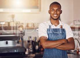 Business owner standing with arms crossed at a cafe, showing pride and success working at a restaurant. Portrait of a waiter, employee or worker giving smile at bakery, looking successful and happy