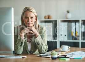 My experience will see me through. Cropped portrait of a mature businesswoman sitting in her corporate office.