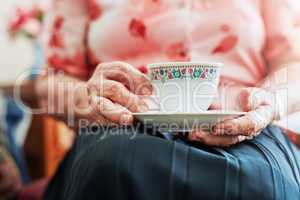 Teatime is my favourite time. s senior woman having a cup of tea.