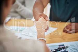 Handshake, contract deal or negotiation closeup at desk at a meeting between professionals. Business greeting, thank you or welcome gesture to show respect with new partnership or onboarding.