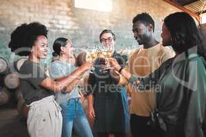 Friends wine tasting, giving cheers and toast celebrate with champagne glasses in cellar, distillery and brewery. Group of happy, diversity and smile people for event, social bonding and winery tour