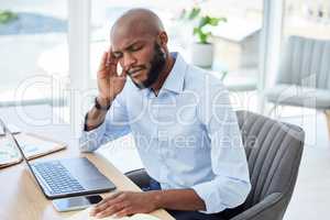 Burnout, headache and stressed businessman working on laptop with problem, bad mental health or stressful job. Male manager rubbing head and feeling overworked, tired or exhausted at web tech company