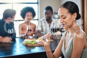 Woman with glass of luxury red wine or quality alcohol drinking in food, culinary or hospitality industry. People wine tasting experience of fruit scent drink with friends in a restaurant background