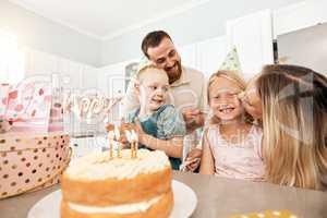 Family birthday party, smile in home kitchen, happy mother kiss girl child, children love fun quality time together and bond over bake cake and food. Kid look at the camera of happiness in house.