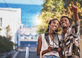 Photographer couple on summer vacation or holiday abroad and tourism with lens flare, ocean and street background. Black people, man and woman looking at tourist destination for travel photography
