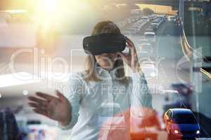 Technology brings vision to her business. Multiple exposure shot of a young businesswoman wearing a VR headset while working alone in her office.