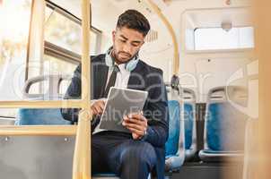 Business man, using tablet and bus for travel to work, home or working location. Relax businessman using headphones, public transport to cbd and mobile device to update social media or check schedule
